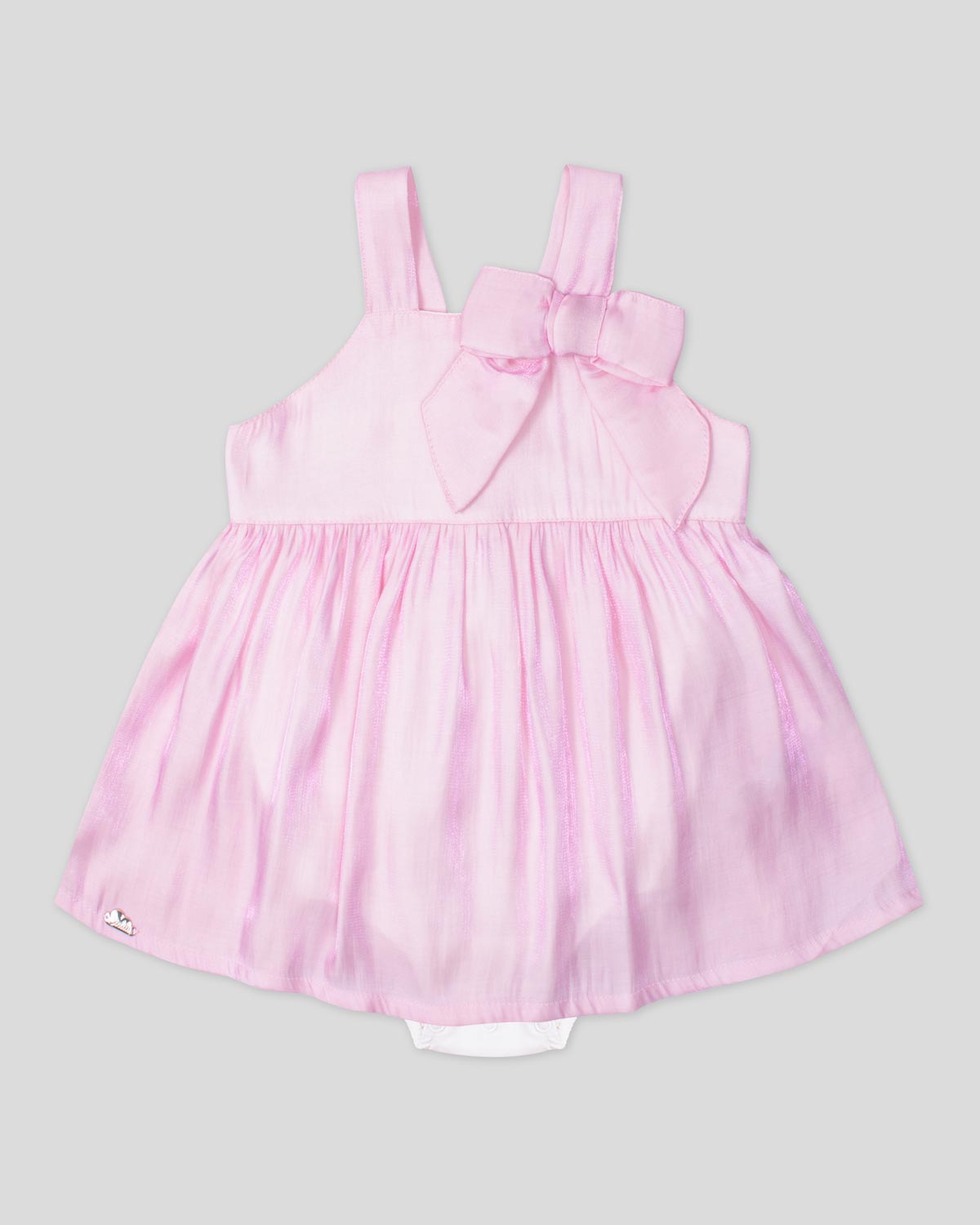 Vestido body rosa en tencel con moñito y visos tornasol para bebé niña