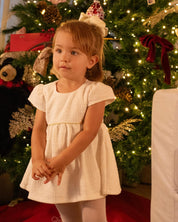 Vestido body blanco con botonadura en espalda para bebé niña