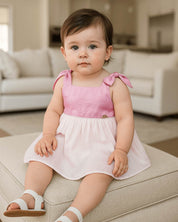 Vestido body rosa y blanco de tiras con moñitos para bebé niña