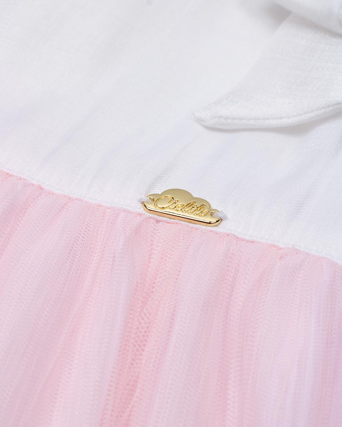 Vestido body en tencel blanco con moñitos y tull plisado rosa para bebé niña