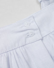 Vestido body en lino blanco con estampado de flores para bebé niña