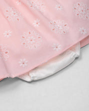 Vestido body rosa en tela hoja rota con estampado de flores y moño blanco para bebé niña