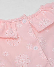 Vestido body rosa en tela hoja rota con estampado de flores y moño blanco para bebé niña