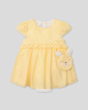 Vestido body en lino amarillo con osito tipo bolso para bebé niña