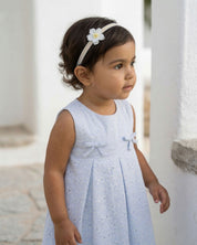 Vestido body en tela hoja rota azul con flores y moñitos para bebé niña