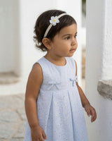 Vestido body en tela hoja rota azul con flores y moñitos para bebé niña