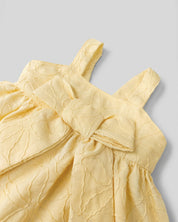 Vestido body amarillo con moño y flores bordadas para bebé niña