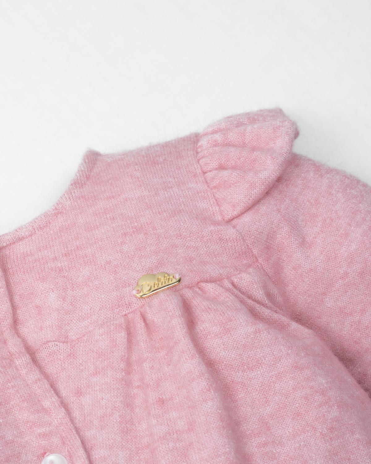 Pijama enteriza rosa con botones y boleros para recién nacida