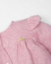 Pijama enteriza rosa con botones y boleros para recién nacida