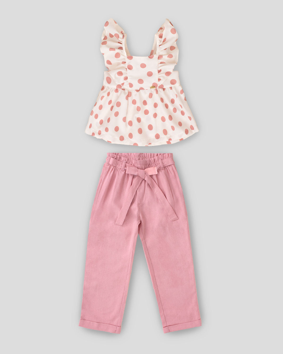 Conjunto blusa con lunares palo de rosa, moño en espalda y pantalón palo de rosa para niña
