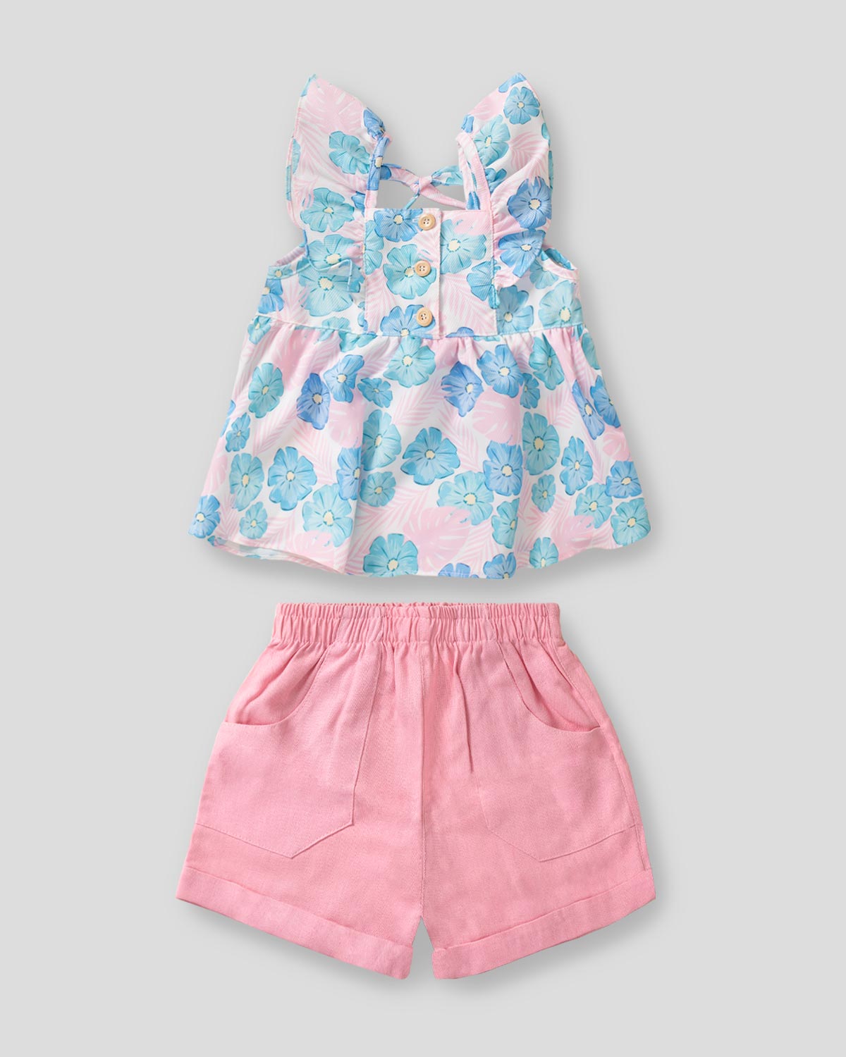Conjunto blusa de flores con boleros en hombro y short rosa para niña 