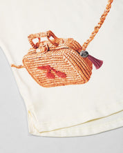 Conjunto blusa vainilla con estampado de bolso y falda rosa para niña