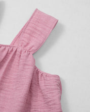 Conjunto blusa rosa de tiras con botones y short blanco para niña