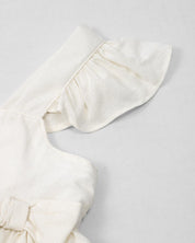 Conjunto de blusa blanca brillante de tiras en boleros y short para niña