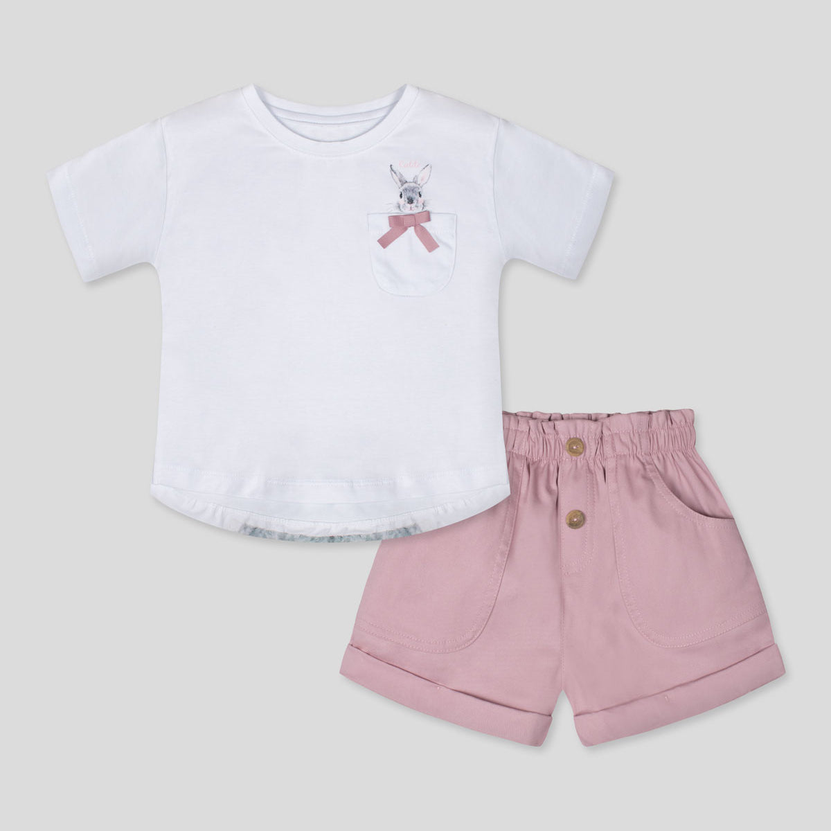Conjunto blusa blanca con bolsillo, estampado en espalda de conejo y short rosa para niña
