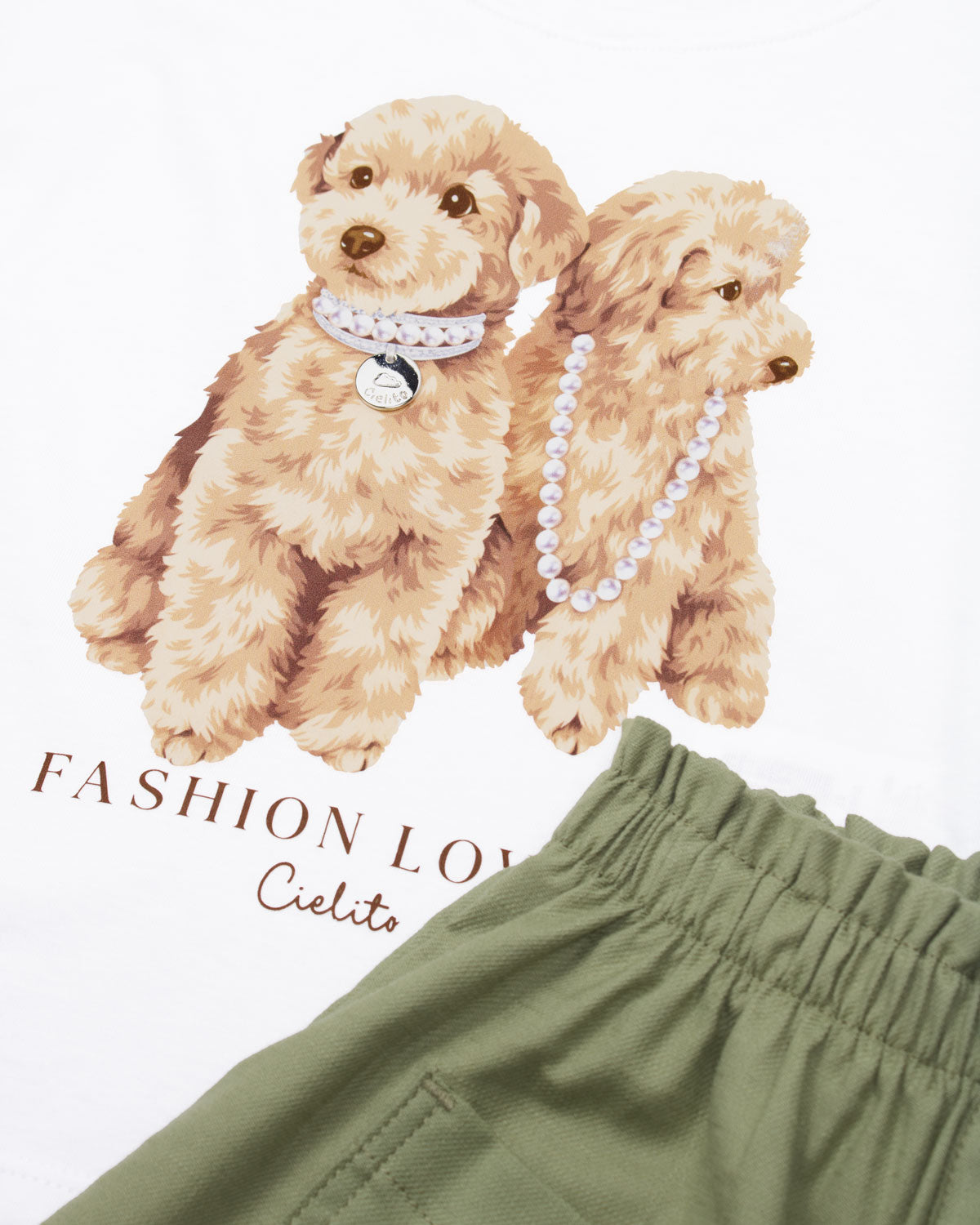 Conjunto blusa blanca estampada manga sisa y short verde para niña