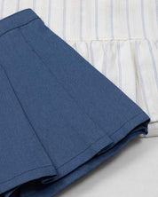 Conjunto blusa blanca con moñitos azules y falda short con prenses azul para niña