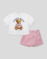 Conjunto blusa blanca con estampado de osita y falda short rosa con moñitos para niña