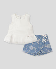 Conjunto blusa blanca y falda short azul con bordado de flores para niña