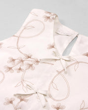 Conjunto blusa blanca con bordados de flores y falda short rosa con pliegues para niña