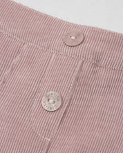 Conjunto blusa chambray con moño y falda short rosa con pliegues para niña