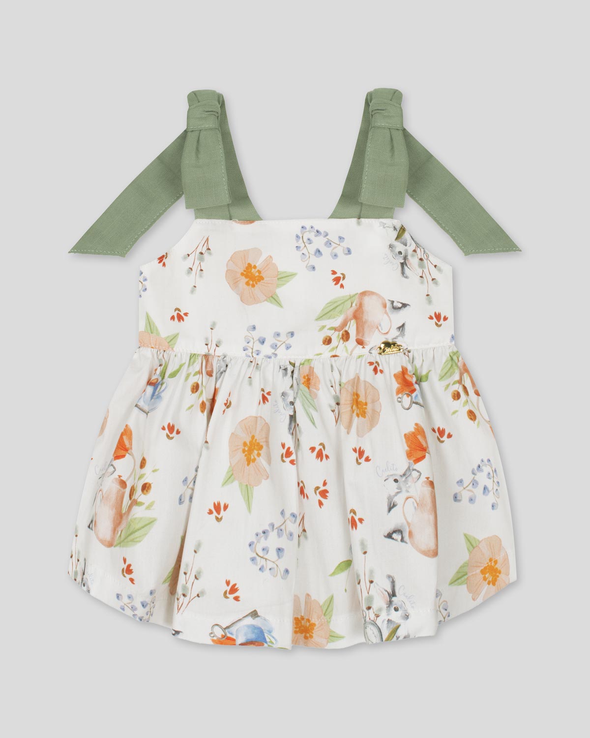 Blusa blanca con estampado hora del té y tiras verdes con nudo moño para niña