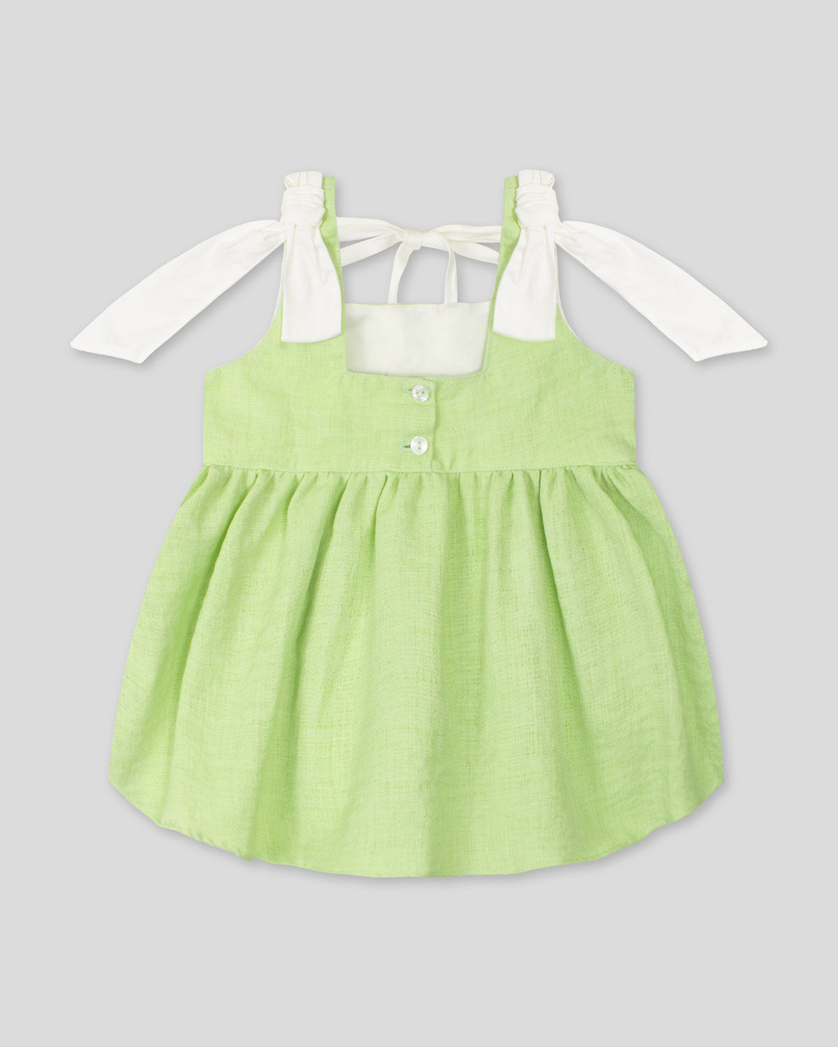 Blusa verde de tiras con detalle de moño para niña