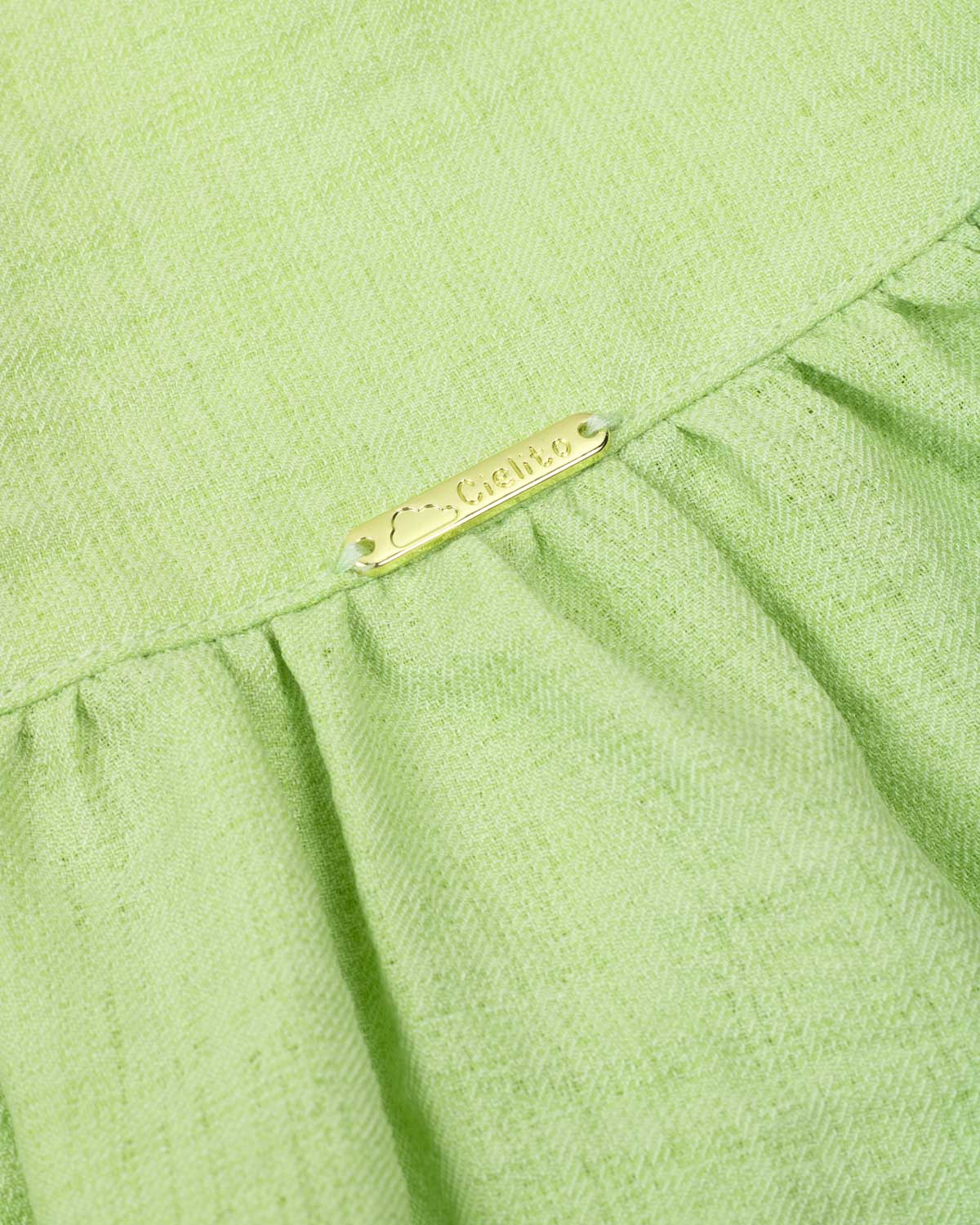 Blusa verde de tiras con detalle de moño para niña