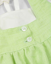 Blusa verde de tiras con detalle de moño para niña