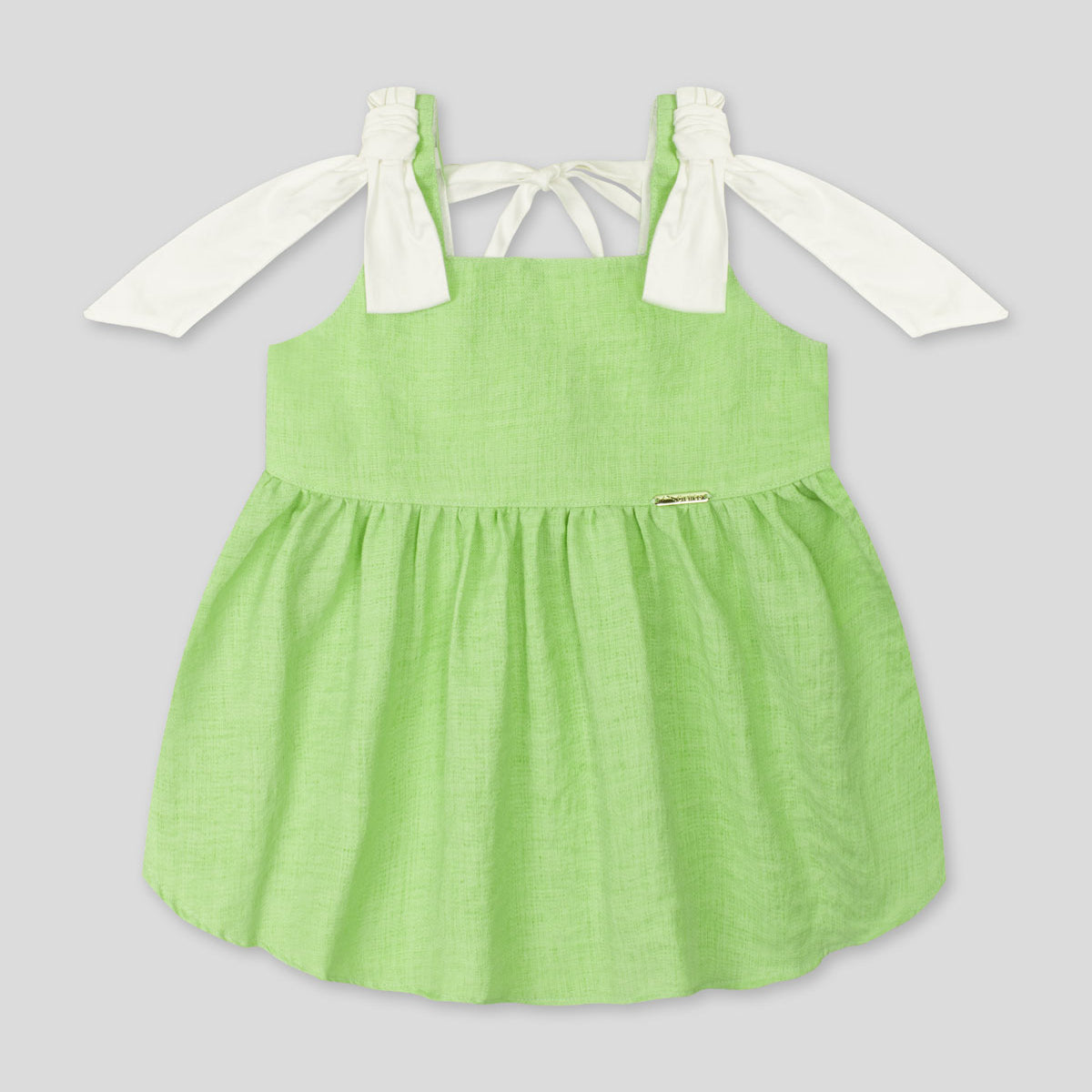 Blusa verde de tiras con detalle de moño para niña