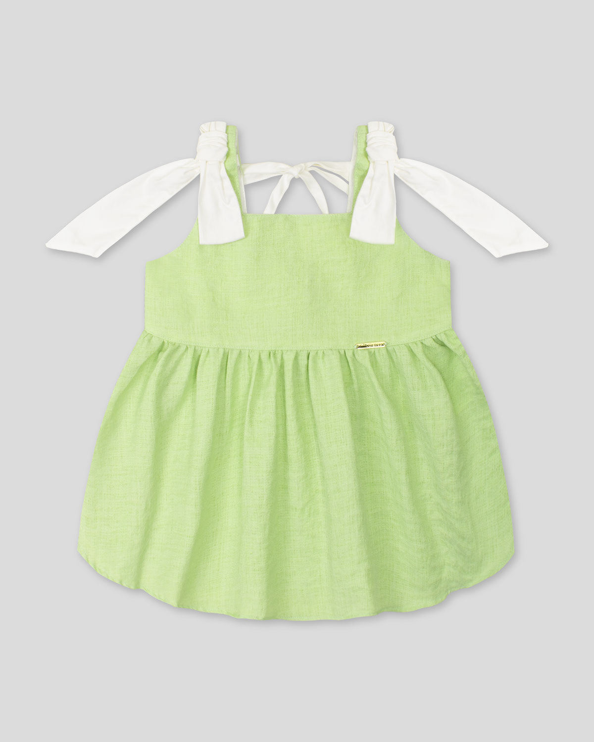 Blusa verde de tiras con detalle de moño para niña