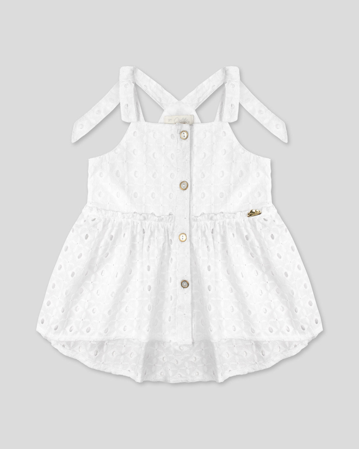 Blusa blanca de tiras con detalle de moño en tela hoja rota para niña