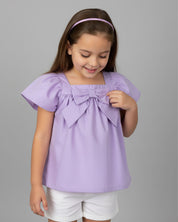 Blusa lila con detalle de moño y botonadura en espalda para niña