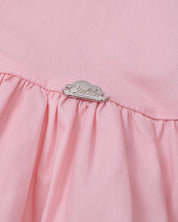Blusa rosa con detalle de moñitos y bolero para niña
