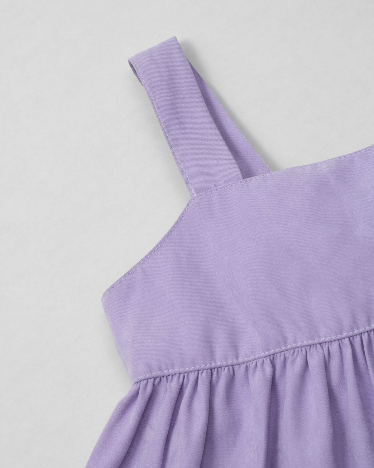 Blusa lila de tiras con moño en espalda para niña