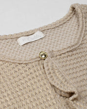 Saco tejido beige con brillos para niña
