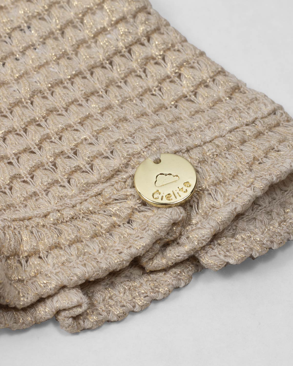 Saco tejido beige con brillos para niña