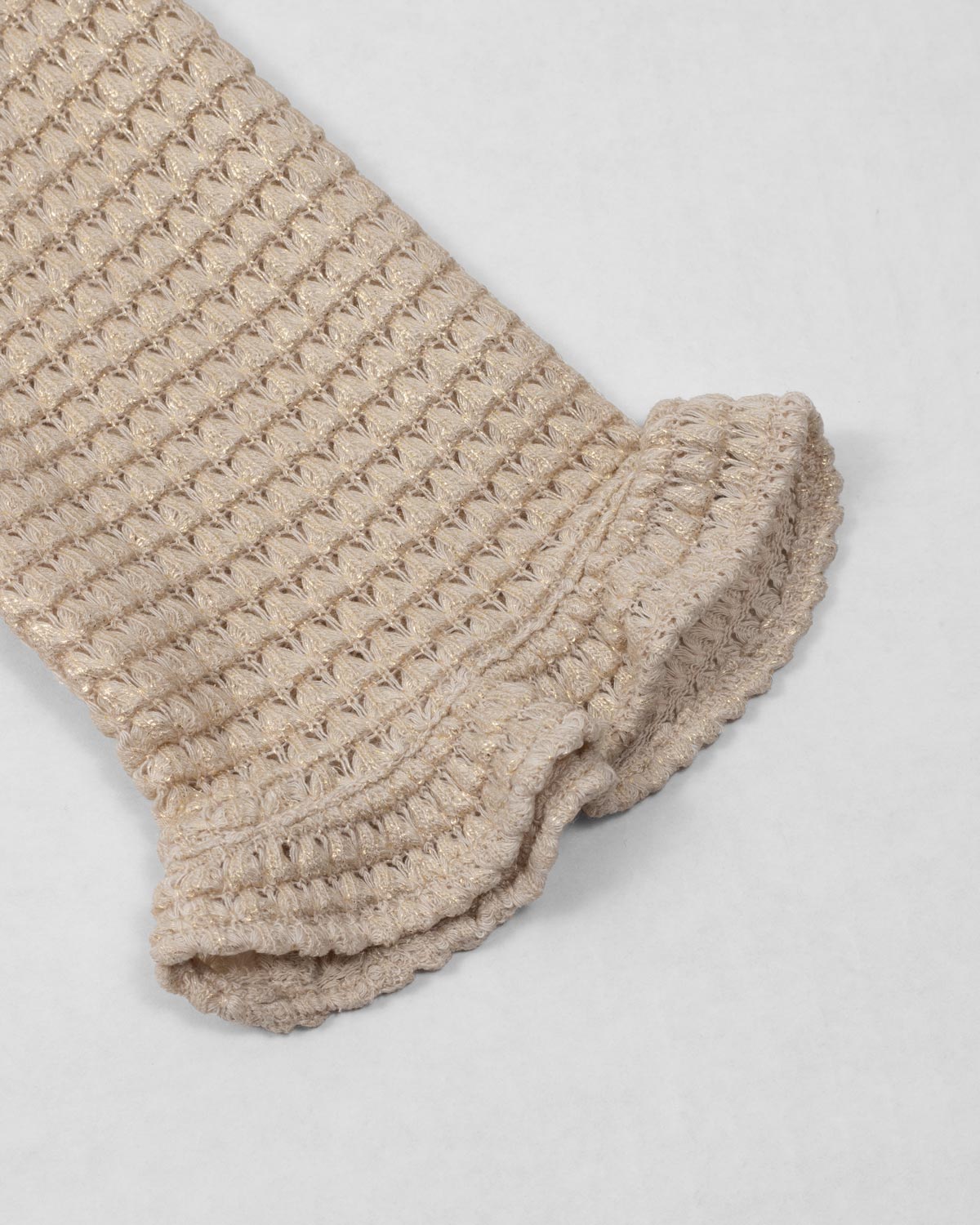 Saco tejido beige con brillos para niña