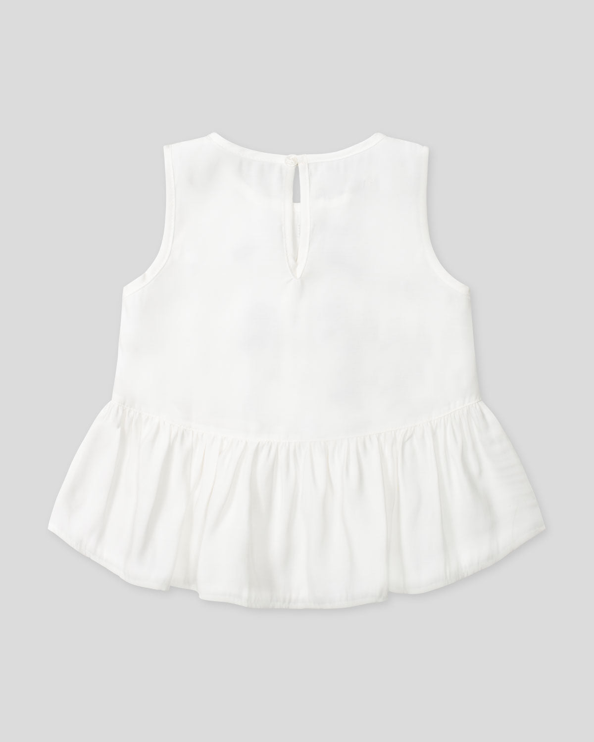 Blusa blanca con moñitos negros y bolero para niña