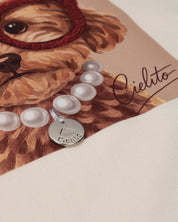 Camiseta crema con estampado para niña