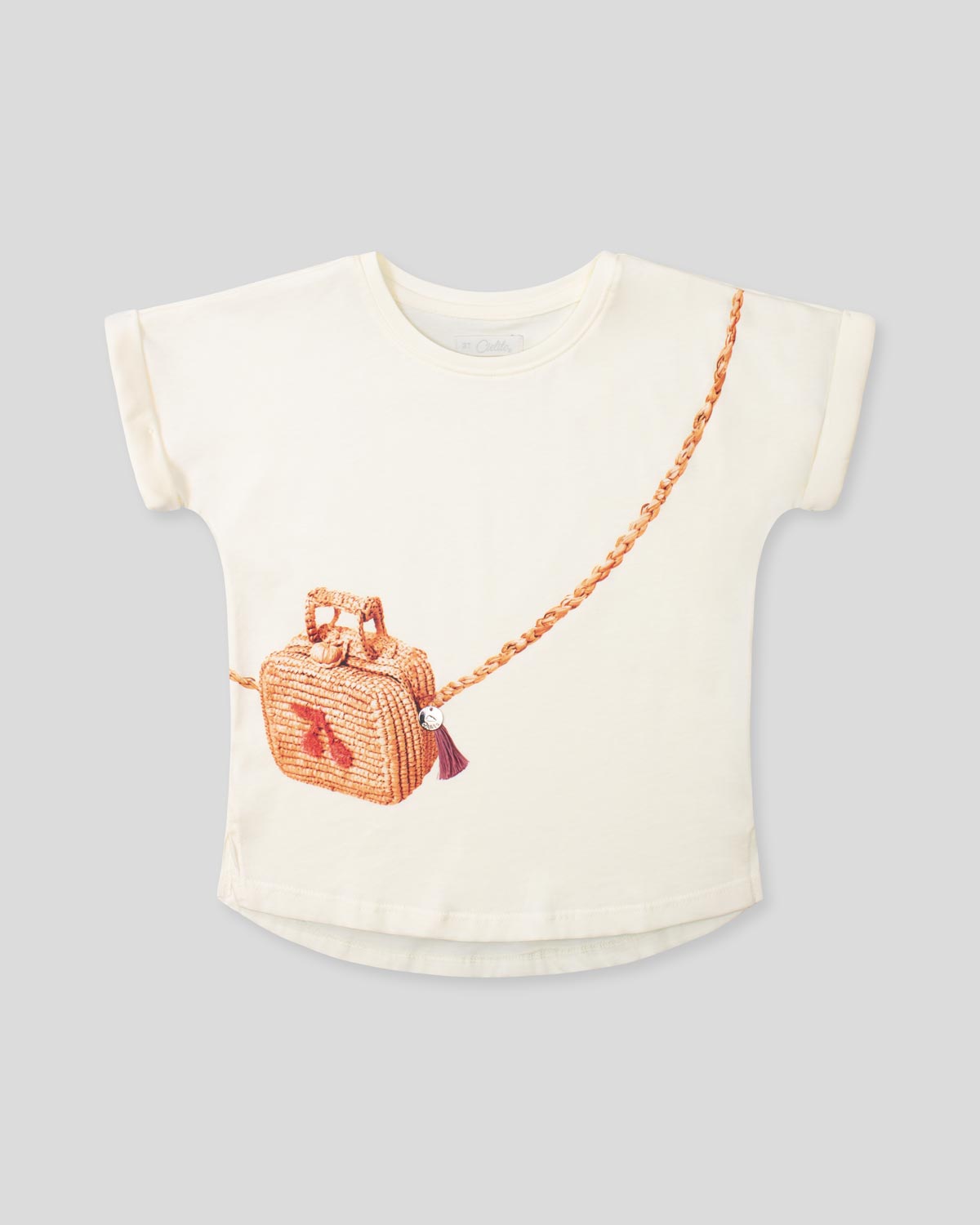 Camiseta vainilla con estampado de bolso para niña