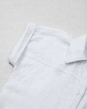 Camisa blanca de botones manga corta para niña