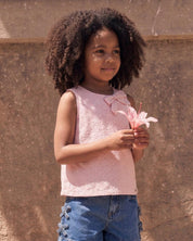 Blusa tela hoja rota rosa con moños para niña