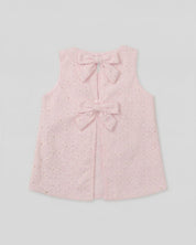 Blusa tela hoja rota rosa con moños para niña