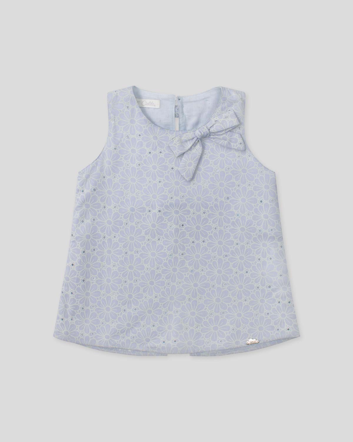 Blusa tela hoja rota azul con moños para niña