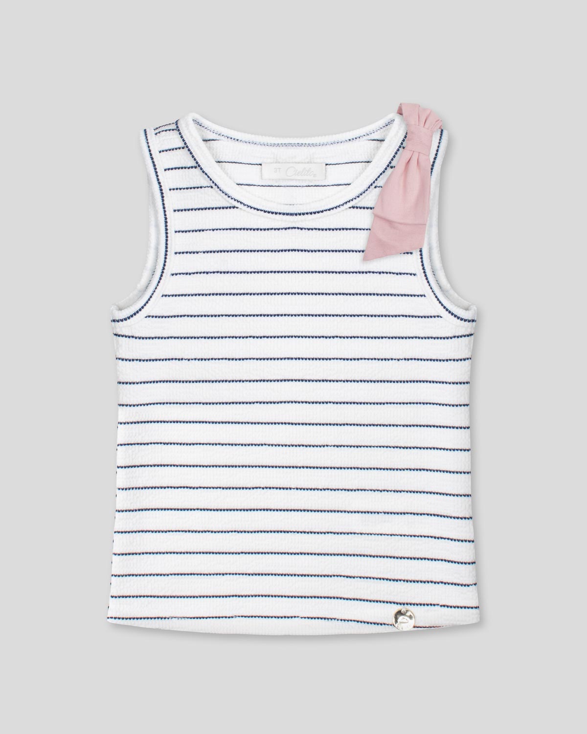 Blusa manga sisa blanca con líneas y moño rosa para niña