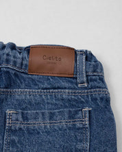 Short denim con apliques de flores tejidas para niña