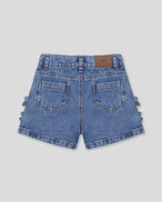 Short denim con moñitos en costados para niña