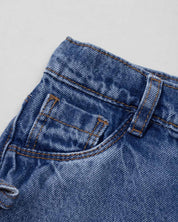 Short denim con moñitos en costados para niña