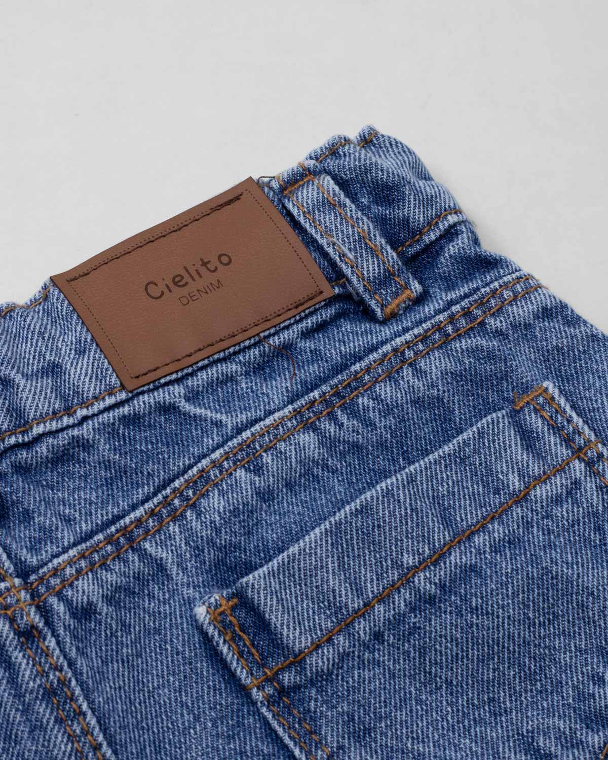 Short denim con moñitos en costados para niña